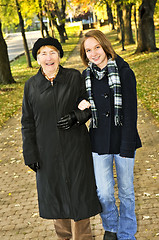 Image showing Granddaughter walking with grandmother