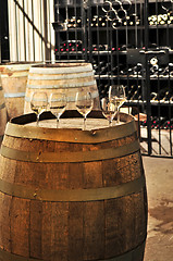 Image showing Wine  glasses and barrels