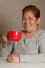 Image showing Woman having coffee