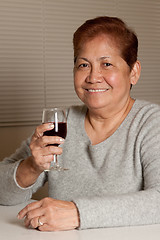 Image showing Senior have wine