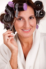 Image showing Woman in rollers