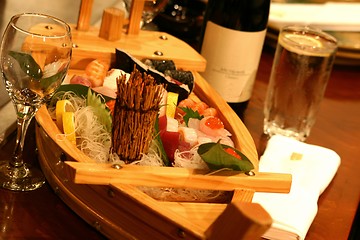 Image showing Sushi boat with an assortment of culinary treats.