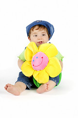 Image showing Baby girl with yellow flower
