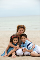 Image showing Mother and kids on the beach