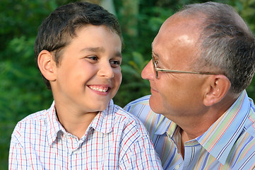 Image showing grandfather and kid outdoors