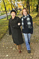 Image showing Granddaughter walking with grandmother