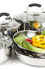 Image showing Stainless steel pots and pans with vegetables