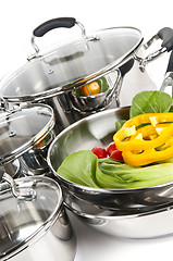 Image showing Stainless steel pots and pans with vegetables