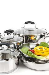 Image showing Stainless steel pots and pans with vegetables