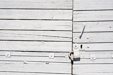 Image showing White wooden gates with lock