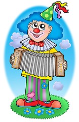 Image showing Clown with accordion on  meadow