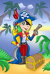 Image showing Blond pirate women with treasure chest