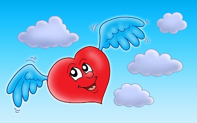 Image showing Flying heart on blue sky