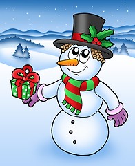 Image showing Christmas snowman in snowy landscape