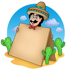 Image showing Mexican man with table in desert