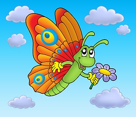 Image showing Butterfly with flower on blue sky