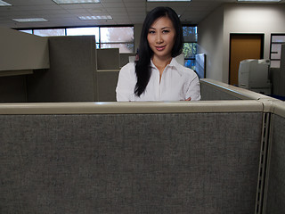 Image showing Woman in cubicle