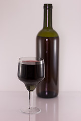 Image showing Glass and bottle with red wine