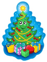 Image showing Smiling Christmas tree with gifts on blue sky