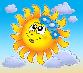 Image showing Smiling Sun with flowers on blue sky