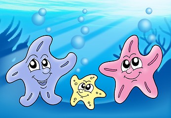 Image showing Starfish family playing with bubbles