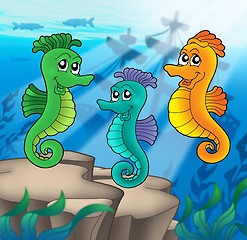 Image showing Sea horses family with shipwreck