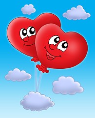 Image showing Smilling hearts balloons on blue sky