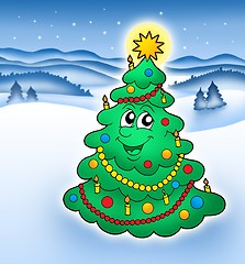 Image showing Smiling Christmas tree in snowy landscape