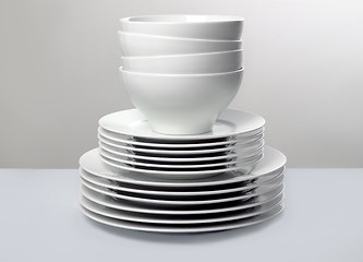 Image showing Classic white dishes against neutral simple background