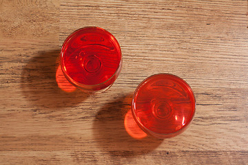 Image showing Two glasses with jelly, oak floor two