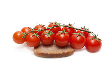 Image showing Red tomatoes cherry, pumpernickel