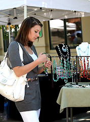 Image showing Girl buying jewelry