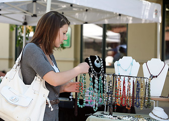 Image showing Girl buying jewelry