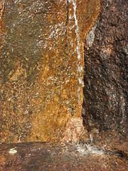 Image showing Running water against a rock