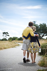 Image showing Young caucasian couple walking in a park