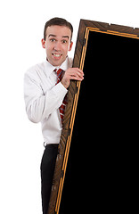 Image showing Businessman Holding Large Frame