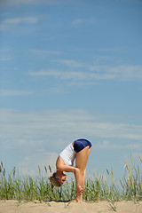 Image showing Beautiful female workout on the beach