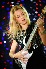 Image showing Female guitar player