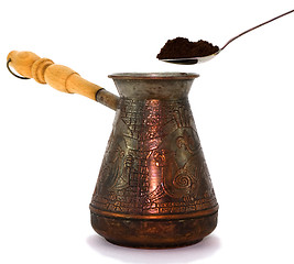 Image showing Turk and spoon with ground cofee