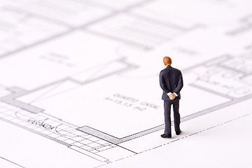 Image showing businessman examining a blueprint