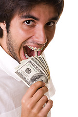 Image showing Eating the money