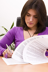 Image showing businesswoman signing documents