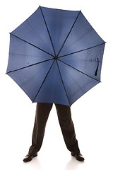 Image showing hiding bewind an umbrella