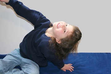 Image showing Cute little girl exercising