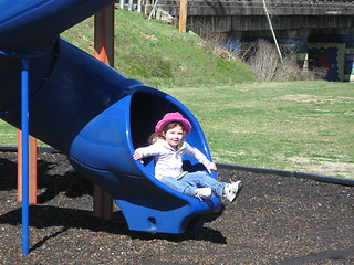 Image showing Little girl on slide