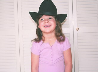 Image showing Little girl in black cowgirl hat