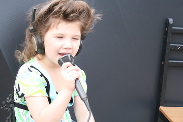 Image showing Little girl singing