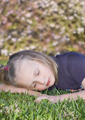 Image showing girl sleeping on the grass