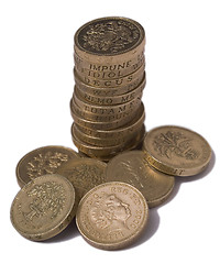 Image showing Isolated pile of British one pound (sterling) coins showing Queen's head and various reverse designs and Latin inscriptions