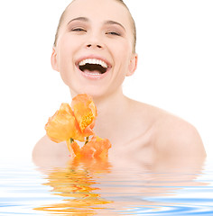 Image showing laughing woman with flowers